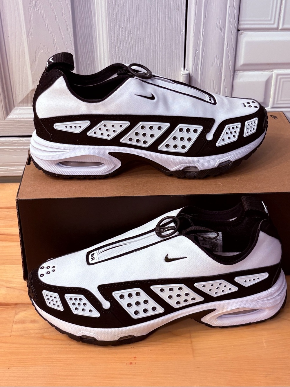 Nike Men’s Black & White Slip-On Sneakers with Toggle